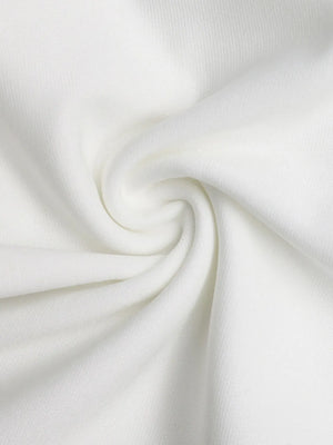 Close-up of white fabric with a subtle swirl pattern