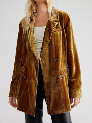 Brown velvet jacket worn by a person on a white background