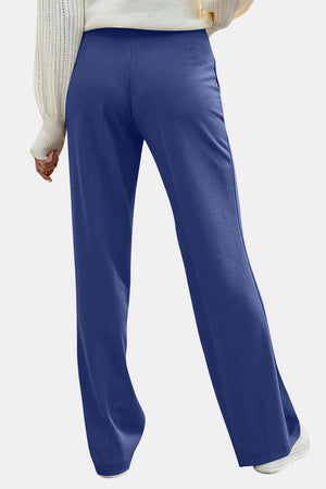 Back view of light blue Decorative Button High Rise Pants