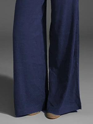 Navy blue wide-leg pants on a gray background