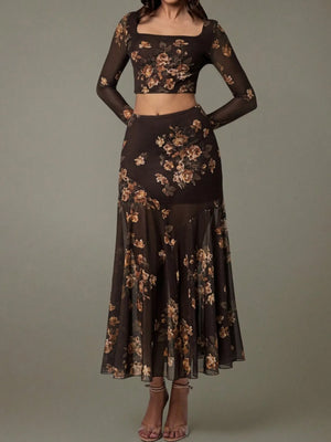 Black floral two-piece outfit on a gray background