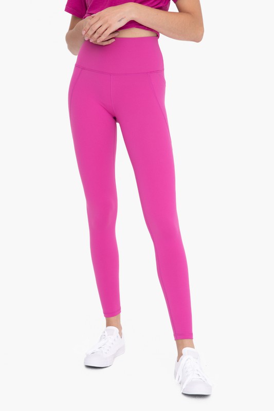 Front view of Tapered Band Essential Solid Highwaist Leggings berry