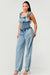Front view of Chambray Charm Ruffled Jumpsuit