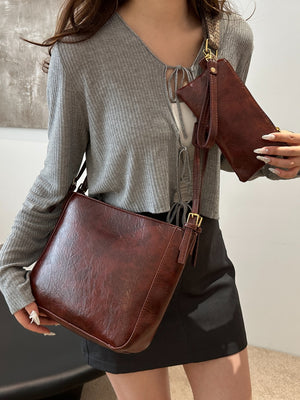 Woman carrying light brown PU Leather Adjustable Strap Crossbody Bag with Pouch