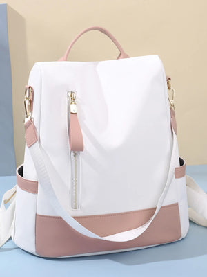 White and pink backpack on a light blue background