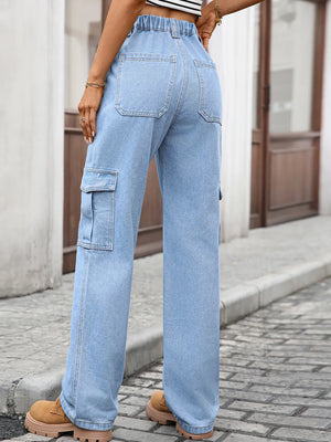 Person wearing light blue cargo jeans on a street.