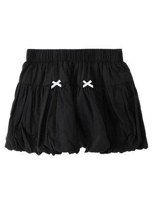 Black skirt with white bow details on a white background