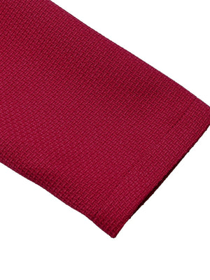 Close-up of a red knitted fabric on a white background