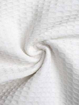 Close-up of textured white fabric