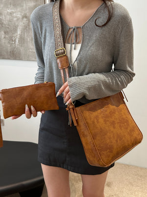 Woman carrying brown PU Leather Adjustable Strap Crossbody Bag with Pouch