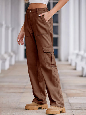 Brown cargo pants worn by a person on a blurred indoor background