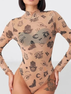 Person wearing a beige bodysuit with black tattoo-like patterns on a white background