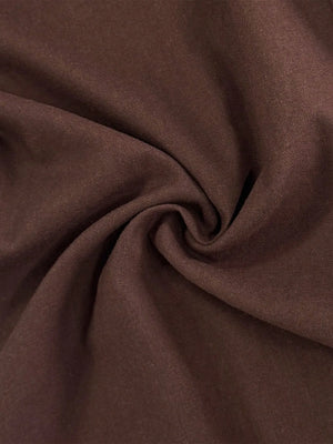 Close-up of brown fabric with folds