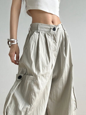 Light-colored wide-leg pants worn by a person on a plain background