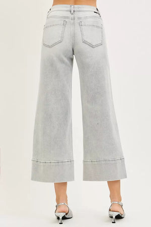 Light gray wide-leg jeans on a plain background