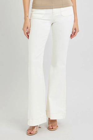 White pants worn by a person on a white background