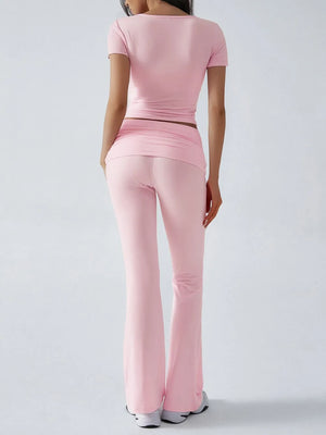 Person wearing a pink outfit on a white background