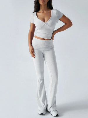 Woman wearing a white outfit with a plain background