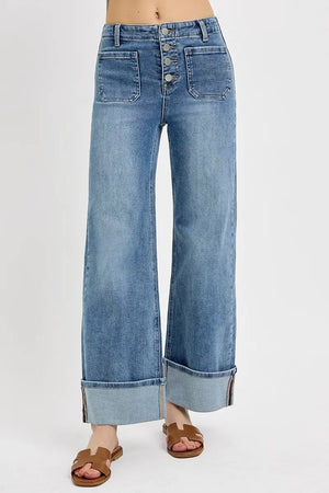 Wide-leg jeans with button fly on a white background