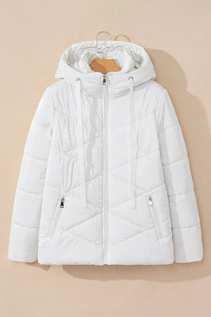 White puffer jacket on a beige background