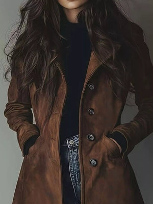 Person wearing a brown leather coat with a plain background