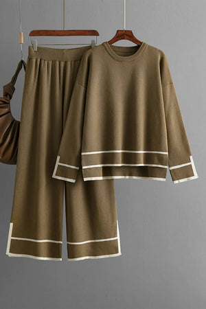 Brown outfit with white trim on a hanger against a gray background