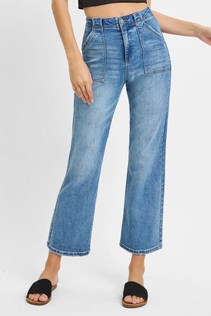 Blue jeans worn by a person on a white background