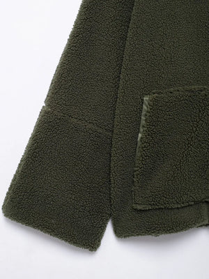 Close-up of a green fleece jacket with a pocket on a white background