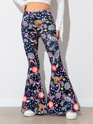 Flared pants with colorful floral pattern worn by a person on a white background