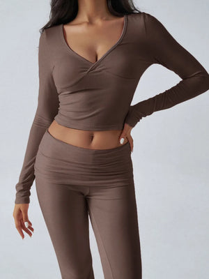 Brown long-sleeve top and leggings set on a plain background