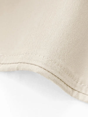 Close-up of beige fabric on a white background