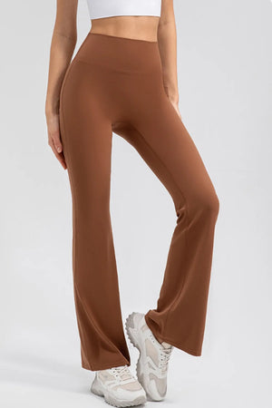 Brown wide-leg pants worn by a person on a white background