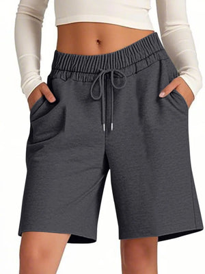 Gray shorts with drawstring waist on a white background