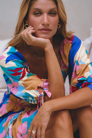 Zoom in view of model wearing Cha-Cha Ruffle Mini Dress-havana