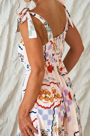 Side view of white Mia Vita Button Down Dress With Ties