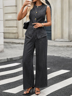 Woman in a black and white striped outfit crossing a street.