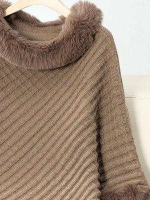 Brown ribbed sweater with fur trim on a hanger against a white background