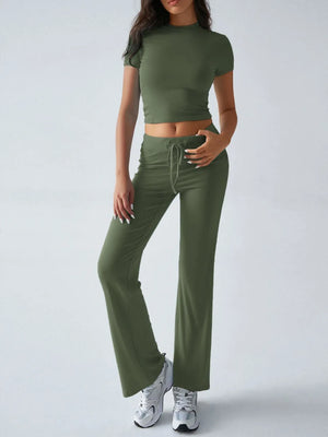 Person wearing a green athletic outfit on a white background