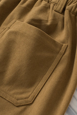 Close-up of brown pants with a pocket