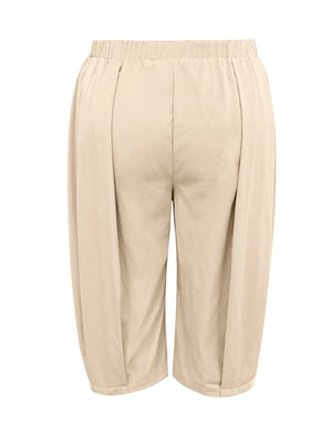 Beige capri pants on a white background
