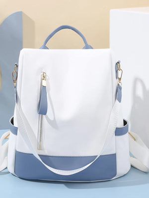 White and blue backpack on a light blue background