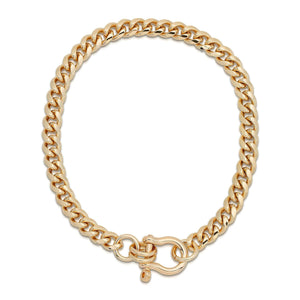 A gold-colored rounded Cuban link chain necklace with a horseshoe clasp.