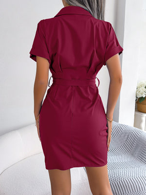 Woman wearing a burgundy dress with a white background