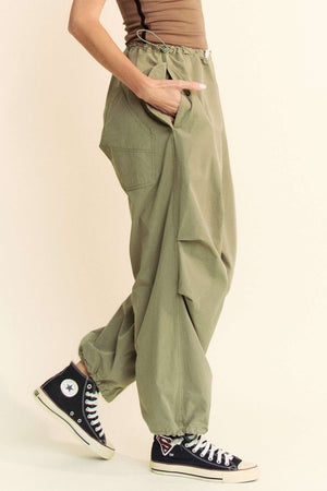 Model showing pocket on Davi & Dani Drawstring Baggy Pants with Pockets