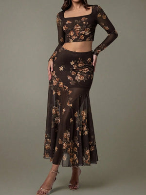 Black floral two-piece outfit on a model against a gray background