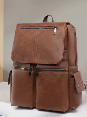 Brown leather backpack on a light gray background
