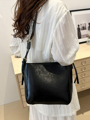 woman carrying black PU Leather Adjustable Strap Crossbody Bag with Pouch