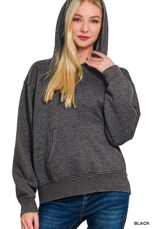 Woman wearing a gray hoodie on a white background