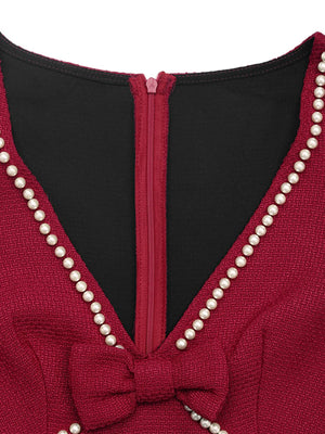 Red garment with pearl detailing and a black interior