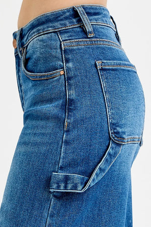 Close-up of blue jeans with a plain background